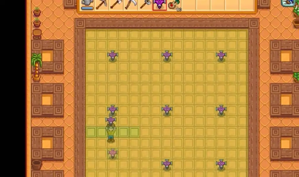 A greenhouse on the farm with large planting area and fruit trees
