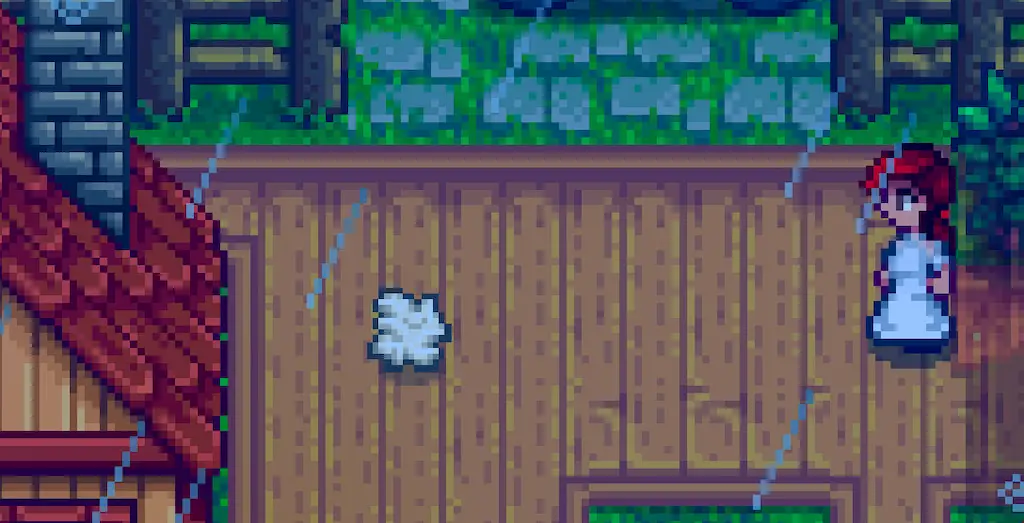 A screenshot of the Stardew Valley game with an item dropped on the ground