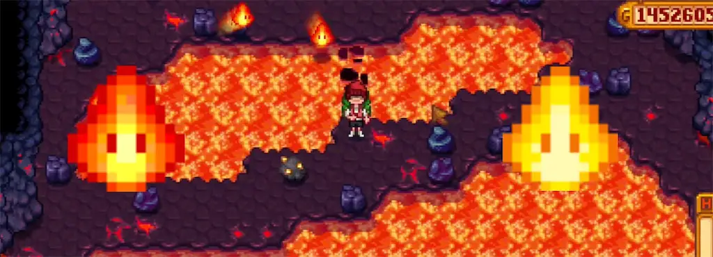 A screenshot of Magma Sprites and Magma Sparker in the Volcano Dungeon in Stardew Valley