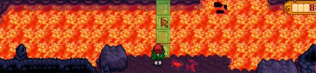 A screenshot of pouring water to enter the Volcano Dungeon in Stardew Valley