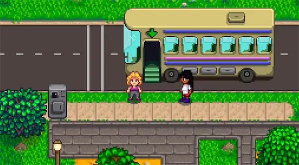 a repaired bus and Pam next to it
